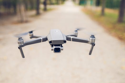 pexels-photo-6726590-6726590 A sleek, modern drone captured flying outdoors in a serene park setting.